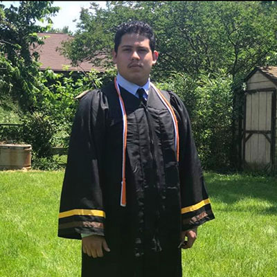 AACC Student, Kevin Lemus, in his graduation robes.