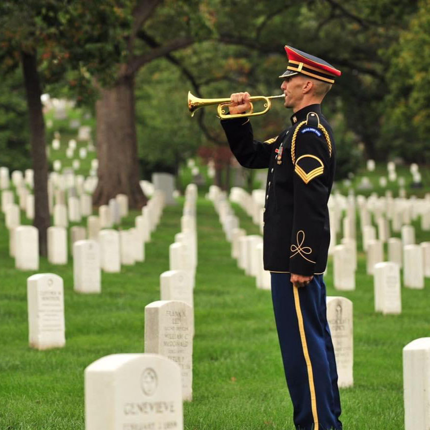 Jesse Tubb playing trumpet in a cemetery