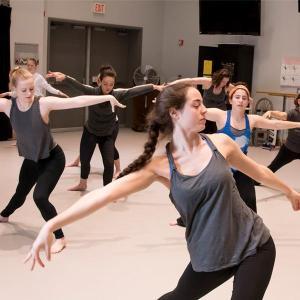 AACC students dance in a studio classroom.