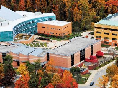 Aerial view of AACC west campus with colorful autumn leaves.