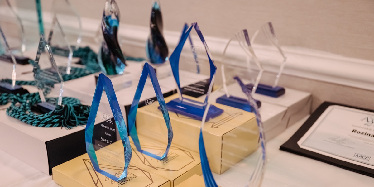 Glass awards sitting on a table.