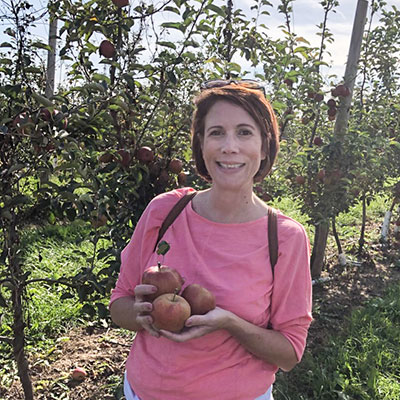 Lori Perez, Psychology chair, in an apple orchard