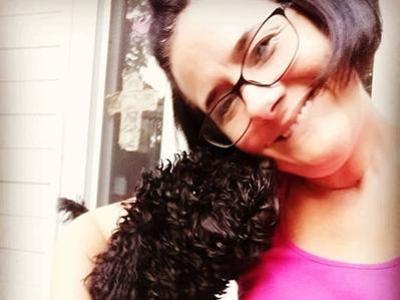 Sara Meinsler, AACC faculty, with her dog.