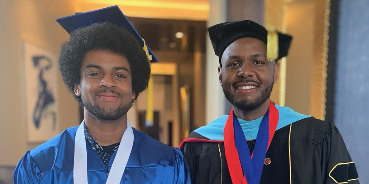 Silas Baker and Professor Darian Senn-Carter at commencement