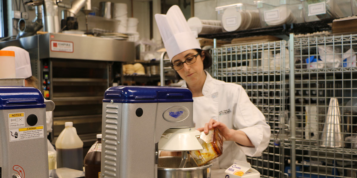 Carrie Svoboda, HCAT student, working in commercial kitchen.