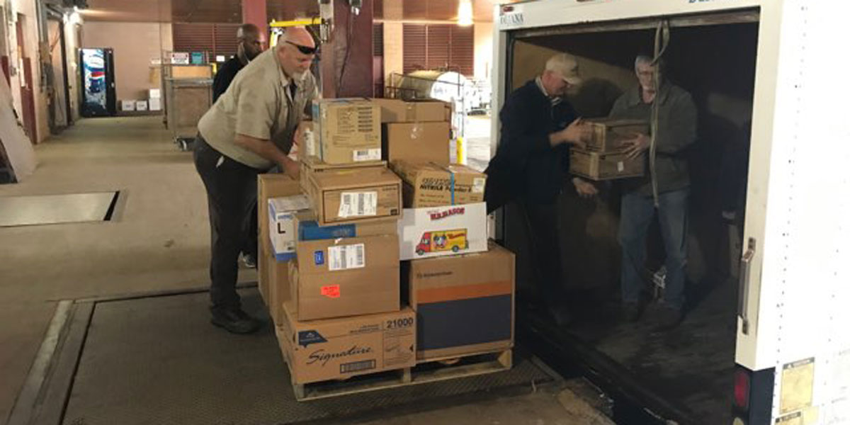 AACC workers filling up a truck with medical supplies