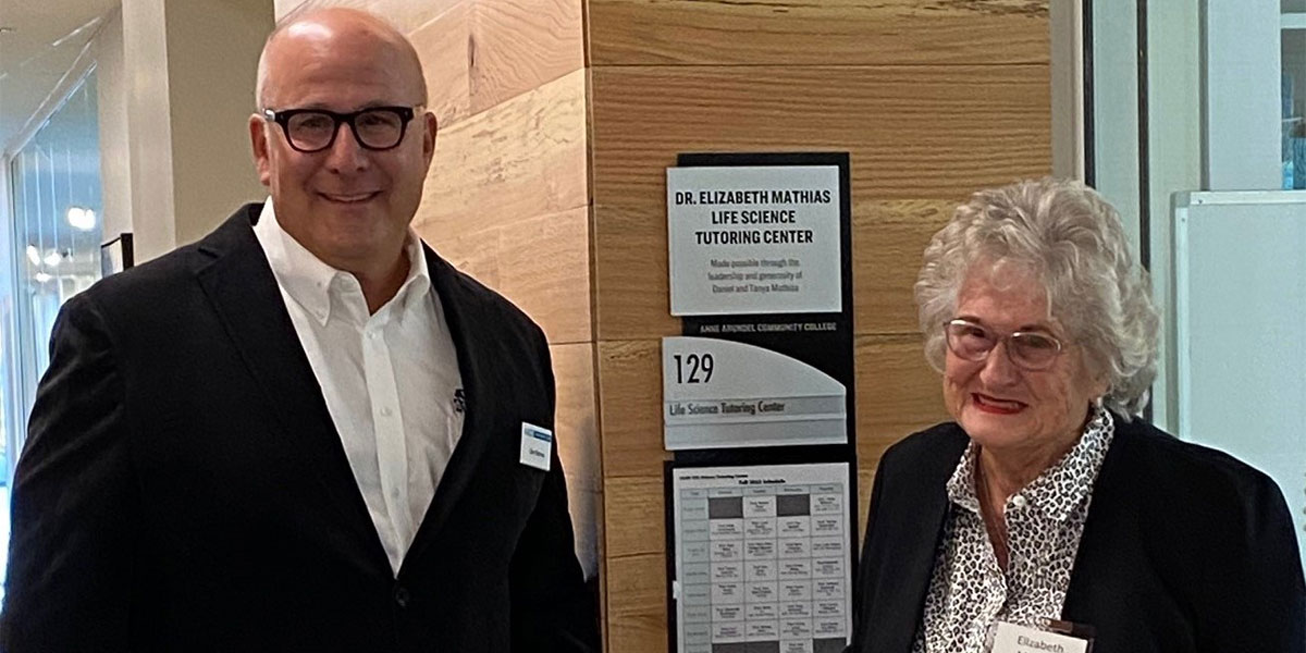 Dan Mathias and Elizabeth Mathias stand outside the Life Science Tutoring Center named in her honor.