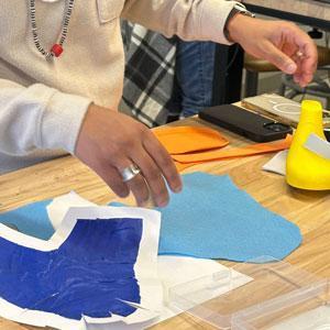 Students working on shoe art project