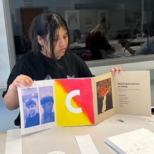 Student presenting art project.