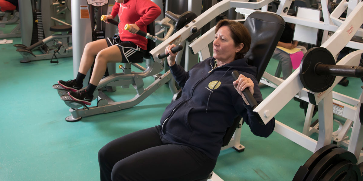 AACC student in weight lifting class.