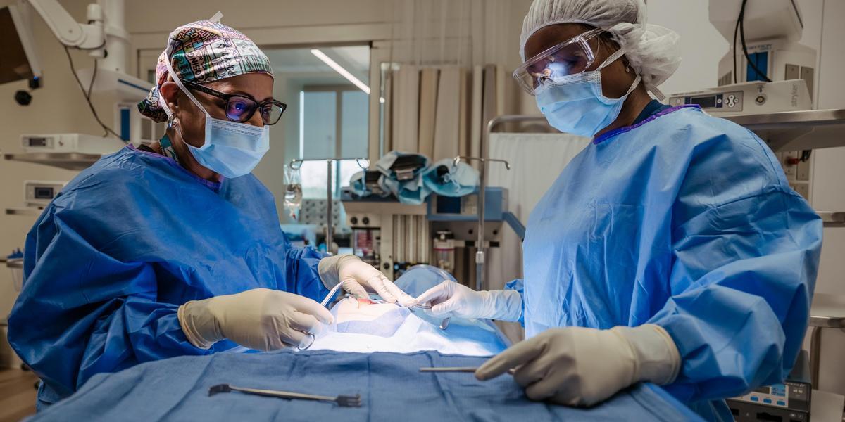Surgical technology students in a lab setting.