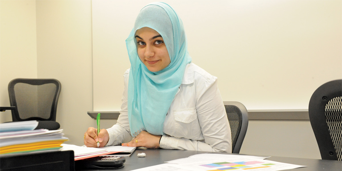 Muslim American student studying