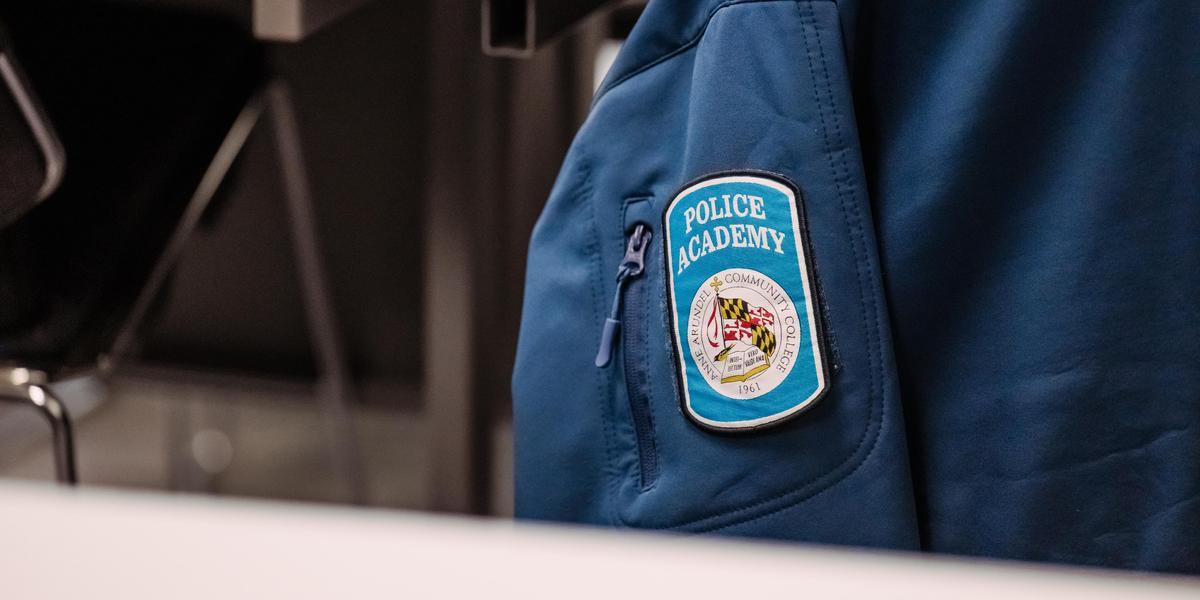 Police academy jacket and patch.