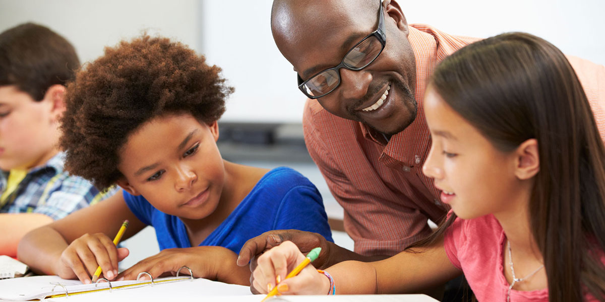 teacher with young students