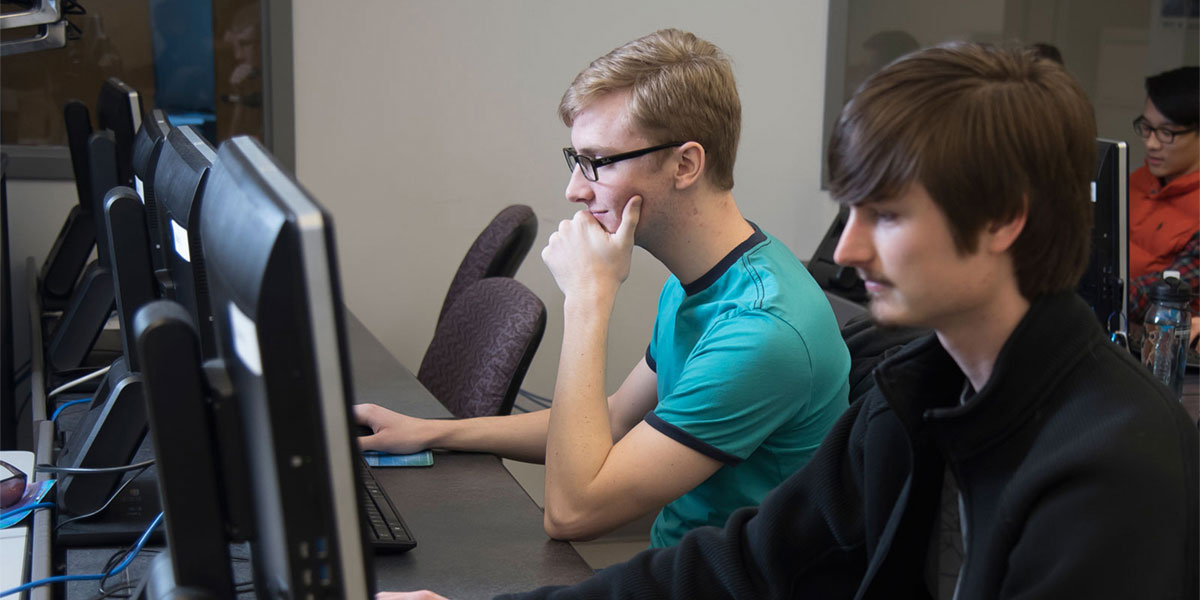 Students at computers in programming class