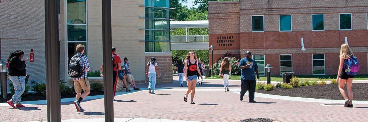 Students walk between buildings on AACC Arnold campus.