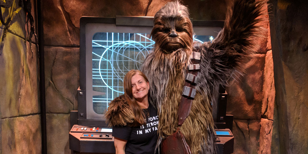 1200x600 of Stephanie Goldenberg posing with Chewbacca