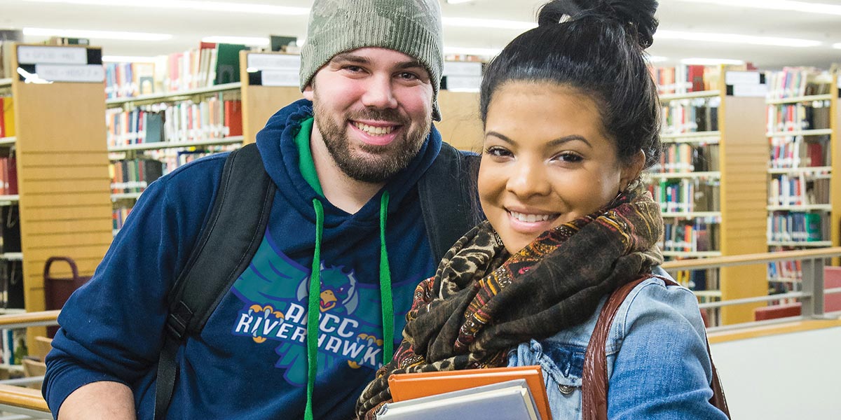 Male and Female students in the AACC library.