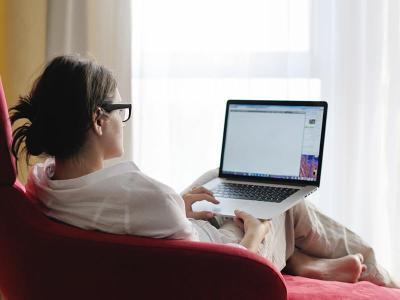 Woman works on her laptop at home.