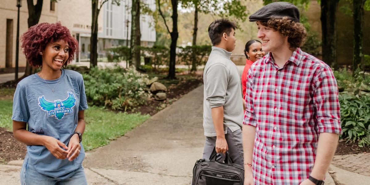 AACC students talking outside.