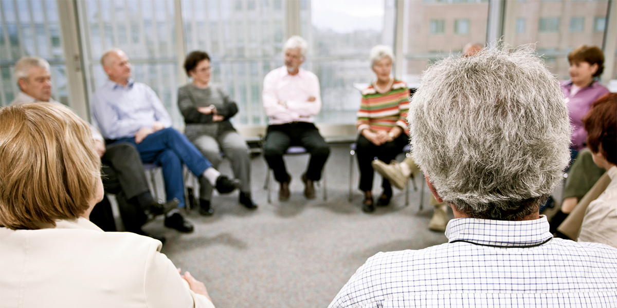 Older Adults in circle talking