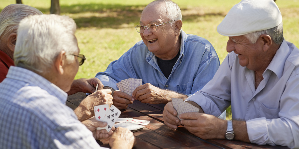 Group of Seniors playing cards