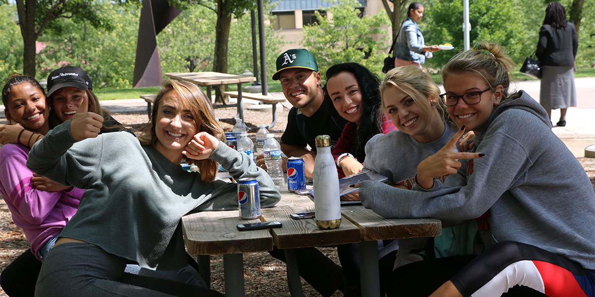 Group of students posing in the Quad.