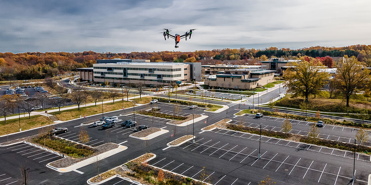 A drone flying over the AACC campus